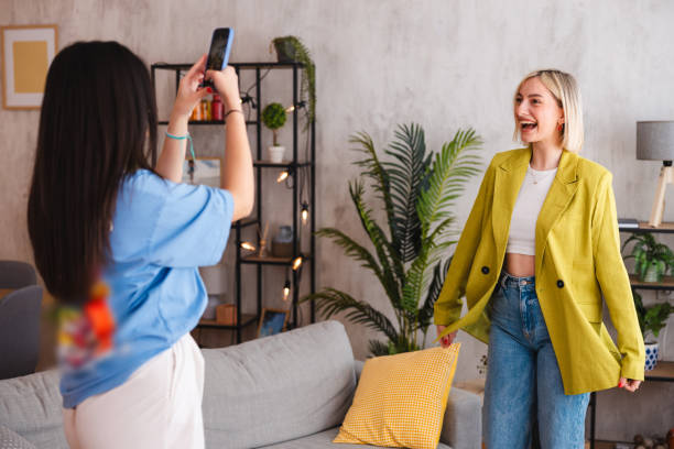 istock Two young women trying on the clothes they ordered online 2154012586