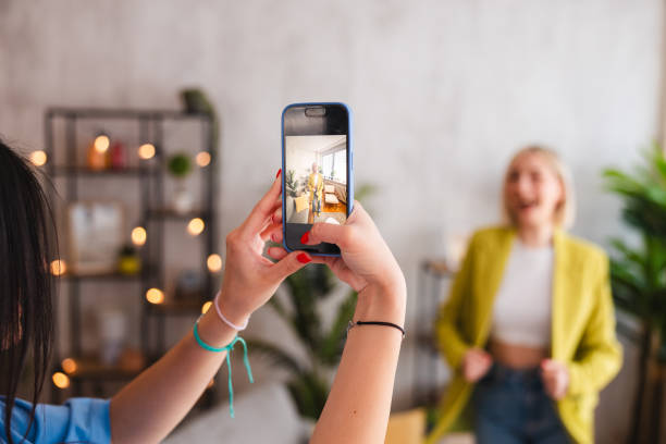 istock Two young women trying on the clothes they ordered online 2154012587