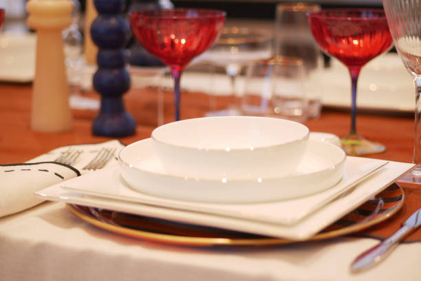 istock round bowl or ceramic plate on napkin on wooden table. 2154014991