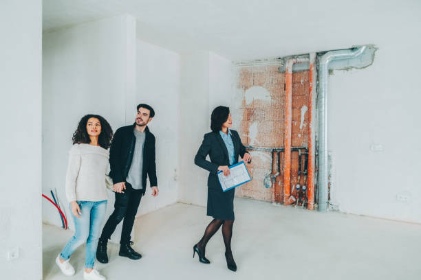 istock Real estate agent showing new home to clients 2154016592