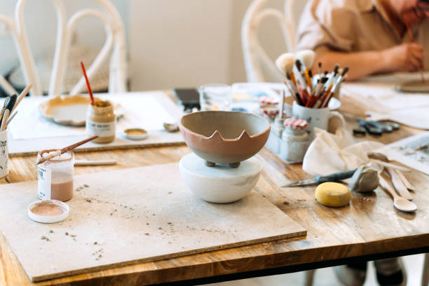 istock Ceramic workshop. Painting the ceramic plate before putting it in the oven. 2154016668