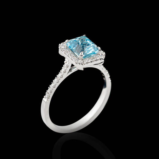 istock Beautiful white gold ring with diamonds and aquamarine on a black background 2154016716