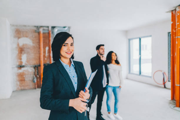 istock Real estate agent showing new home to clients 2154016829