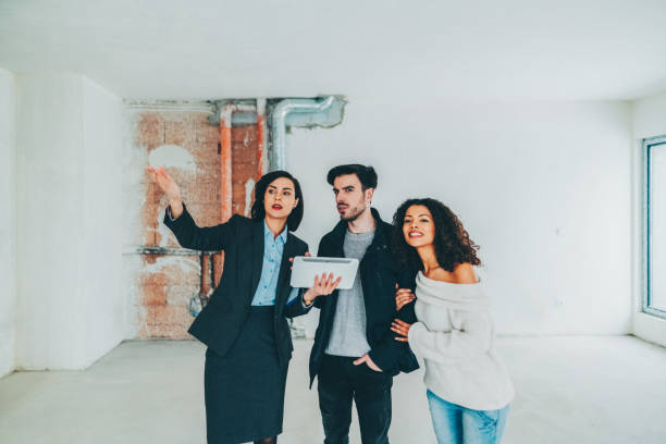 istock Real estate agent showing new home to clients 2154016957