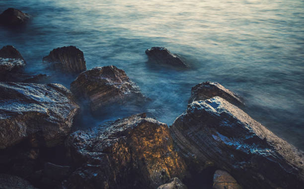 jetty made of rocks in the Gulf of Salerno, off of the Amalfi Coast in Amalfi, Italy