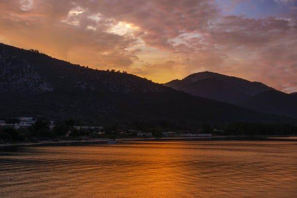Scenic view of the sun rising over hills