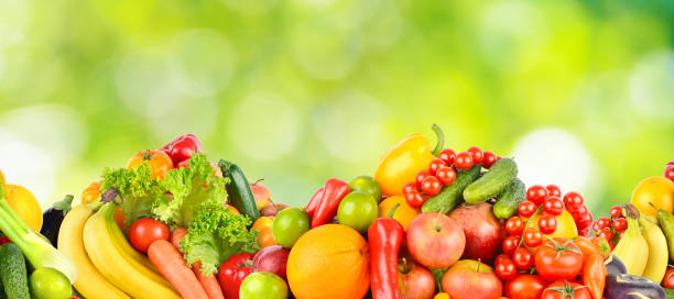 istock Panorama multicolored fresh fruits and vegetables on green background. 2154019044