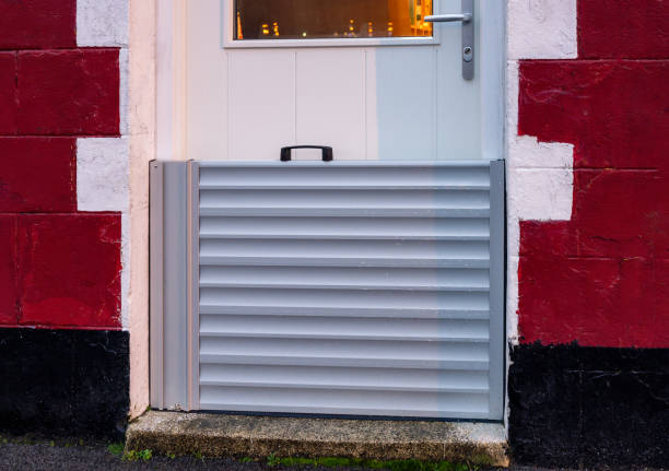Metal flood protection barrier Close up of a modern metal flood protection barrier.. flood preparation stock pictures, royalty-free photos & images