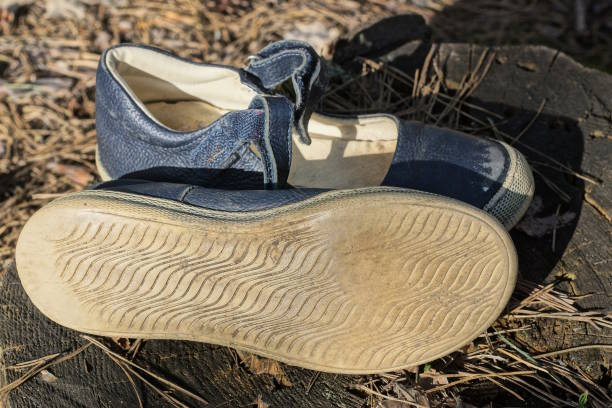 istock two blue leather sandals stand on the gray ground 2154025206