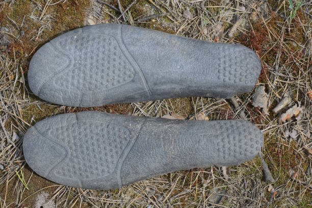 istock two old dirty black plastic insole shoe sole 2154025255