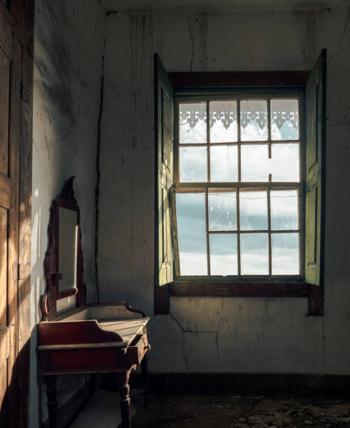 Old abandoned room with empty desk at sun light