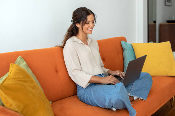 istock Remote Work. Smiling Young Female Typing On Laptop At Home, 2154026296