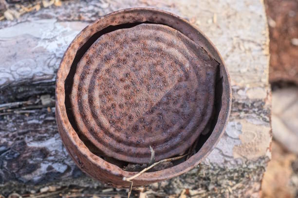istock one brown round rusty iron tin can lies on the gray table 2154027120