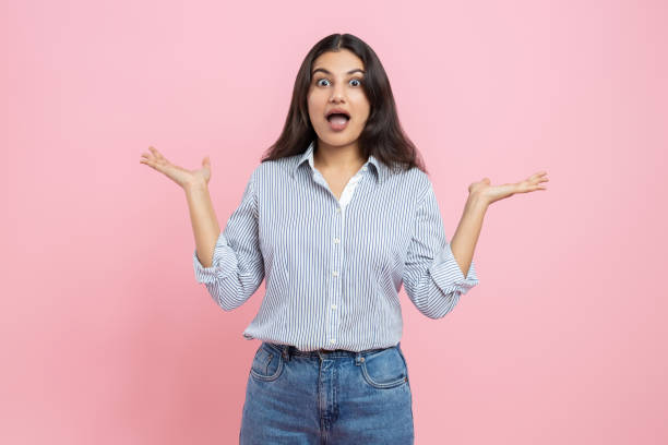 istock Shocked Indian woman spreading hands 2154028976