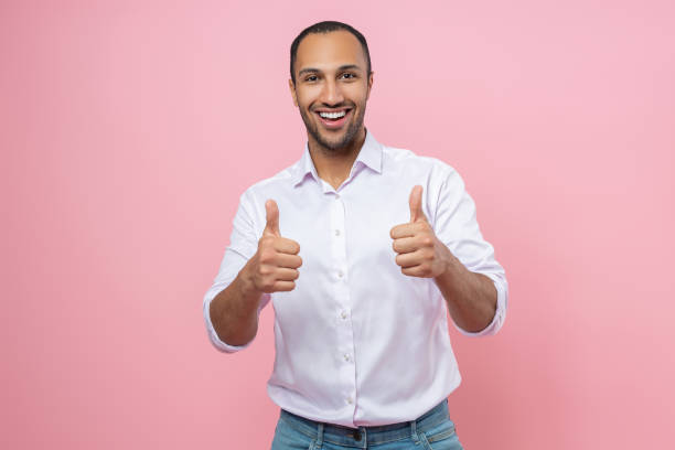 istock Delighted man in white shirt showing like gesture 2154029013