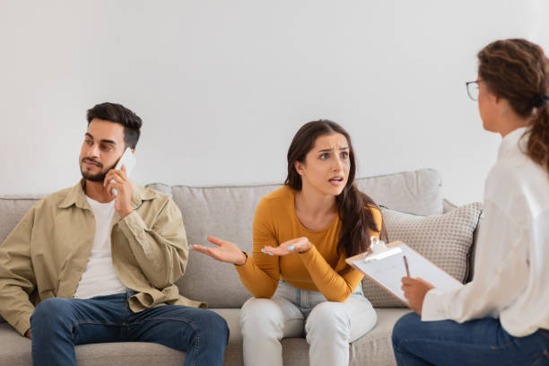 istock Couple in therapy session with counselor, crisis in relationships 2154036263