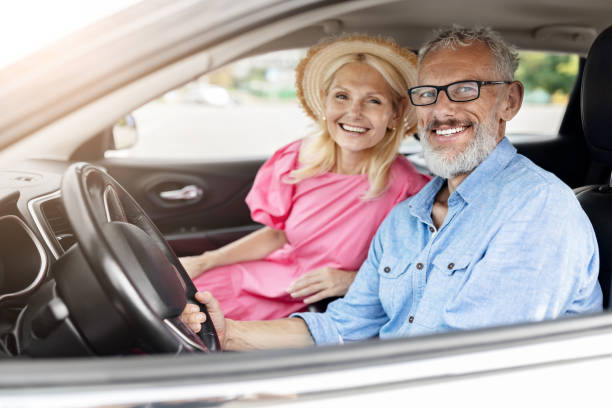 istock Happy elderly couple in car with window down 2154037609