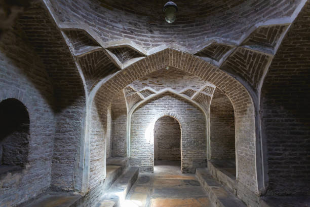 istock Bukhara, historical bath (hammam). Arched brickwork and intricate vaulting with subtle lighting. Bukhara, Uzbekistan 2154046381