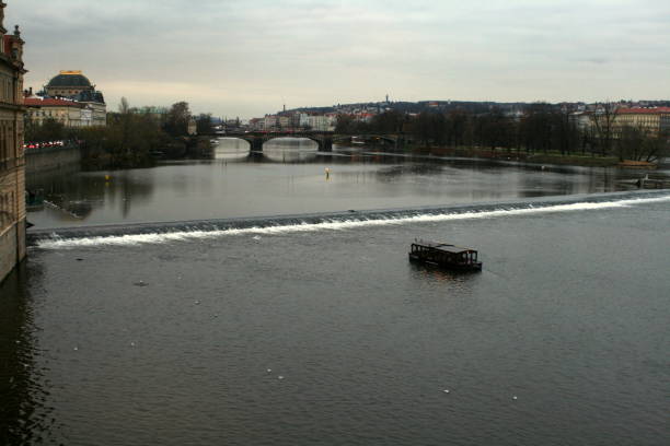 Prague, Czech Republic, with views of the church, statues, river, and old town square
