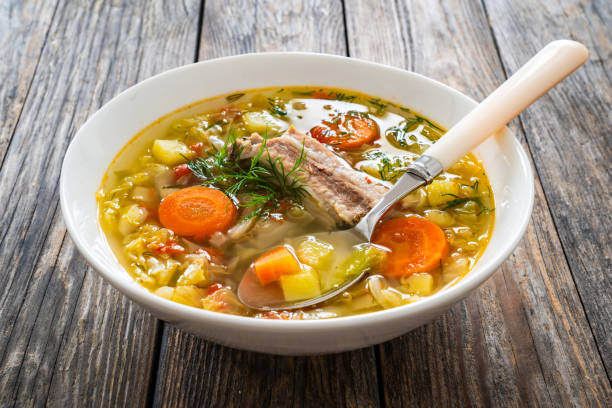 istock Cabbage soup with pork ribs and boiled potatoes served on wooden table 2154050372