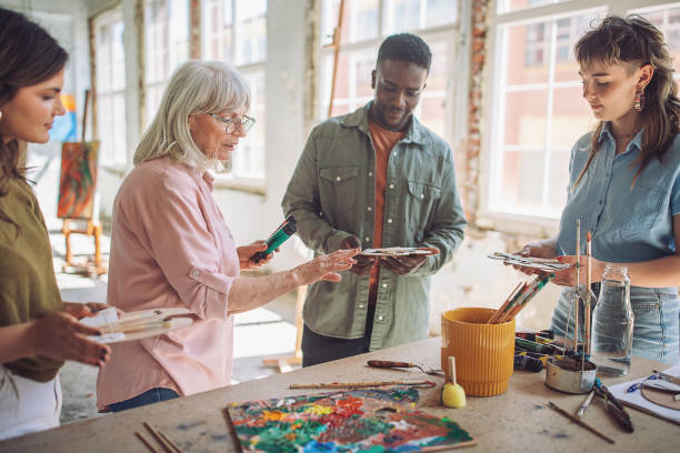 istock Art class in progress: teacher guiding aspiring painters 2154052254