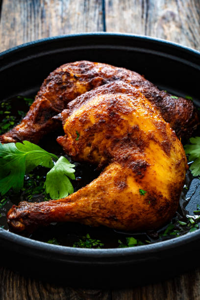istock Roasted chicken thigh on wooden table 2154052260