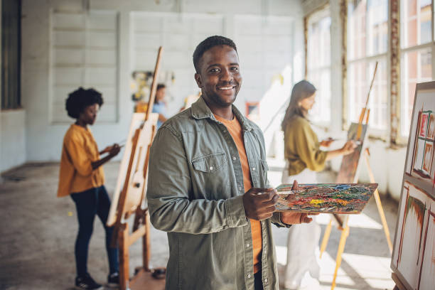 istock Art class in action: teacher and students engaged in canvas painting 2154054048