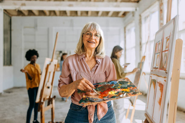 istock Artistic endeavors: teacher and students engage in painting class 2154054219