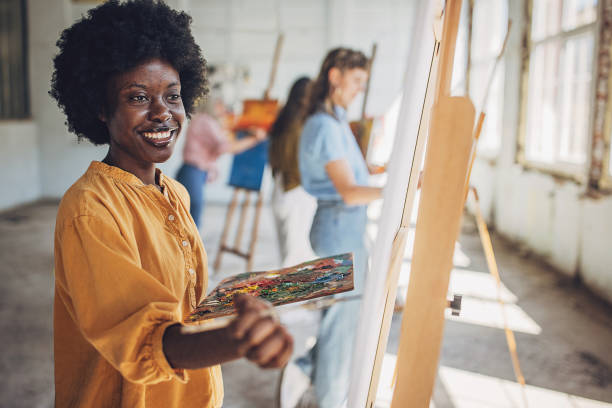 istock Art class in session: teacher and students engage in canvas painting 2154054368