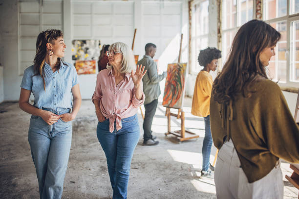 istock Art school creativity: teacher and students in painting workshop 2154054472