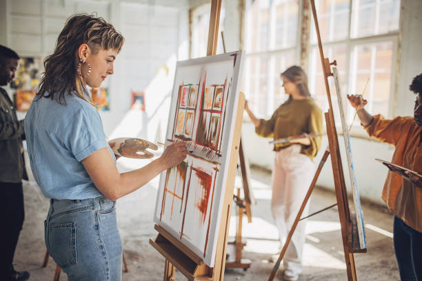 istock Art school creativity: teacher and students engage in canvas painting 2154054988