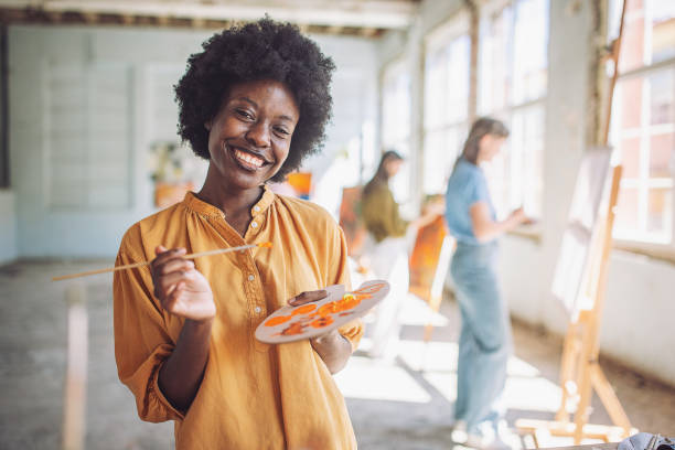 istock Exciting and joyful art class session with smiling students and creative teacher at the art school 2154057260