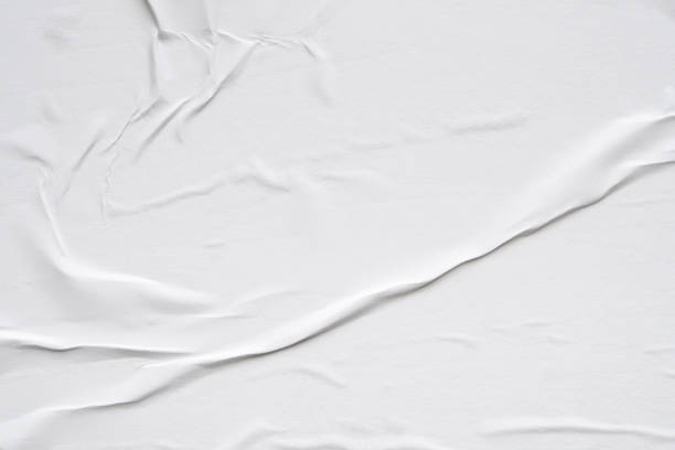 istock White blank crumpled and creased paper poster texture background 2154057394