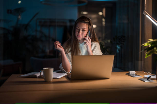 istock Female Business Professional Working Late in Office 2154057448