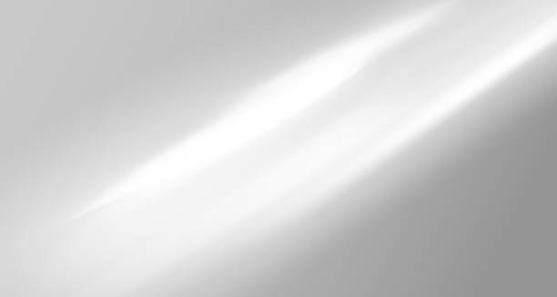 istock Glare from the sun's rays on the wall. Blurred shadows from leaves and plants in the room. Soft overlay of natural light. Abstract background for product presentation.Natural light layout. 2154057562