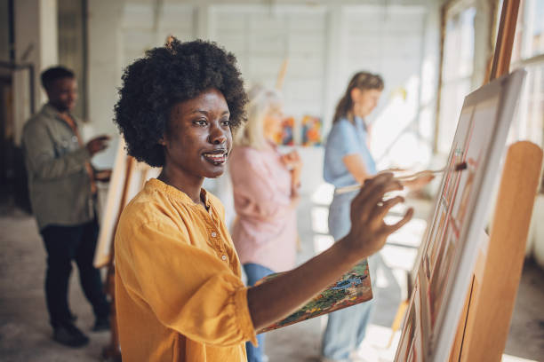 istock Art school creativity: teacher and students engage in canvas painting 2154060850