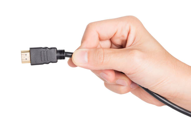istock closeup hand holding HDMI plug 2154064318