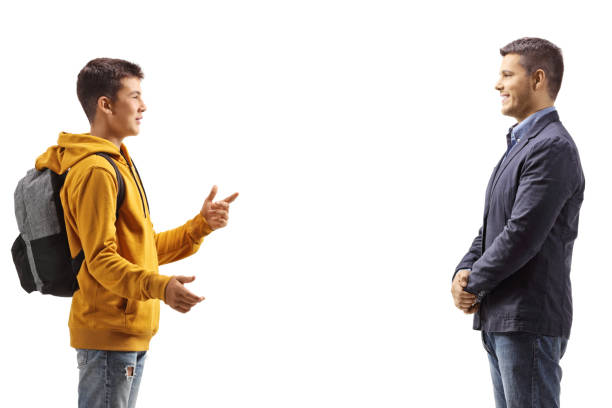 istock Boy having a conversation with a professional young man 2154066573