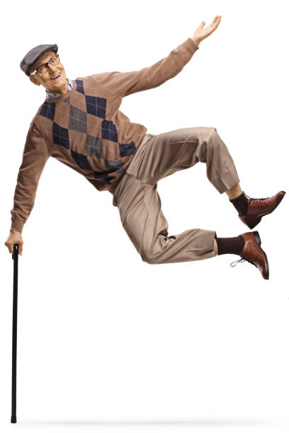 istock Healthy elderly man leaning on a walking cane and jumping 2154066625