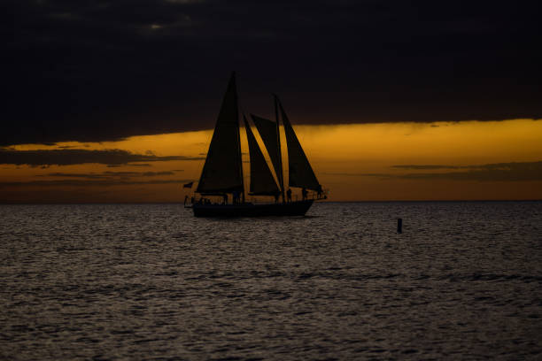 A yacht sailing into the sunset just of Clearwater beach in Florida on a gorgeous evening.