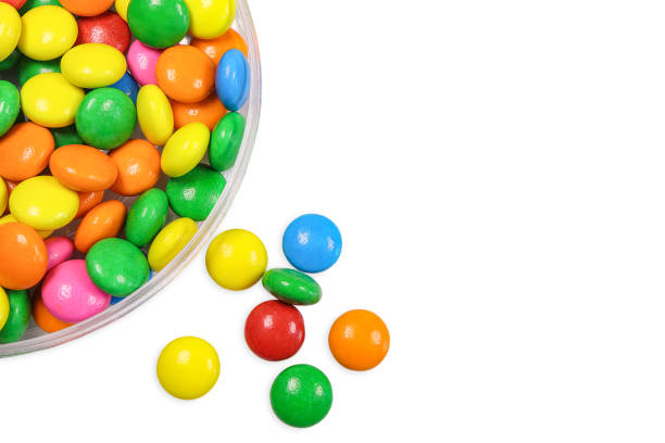 istock Colourful chocolate candies, multicolored glazed chocolate in a box on white background with clipping path.Top view Milk chocolate candy 2154075309