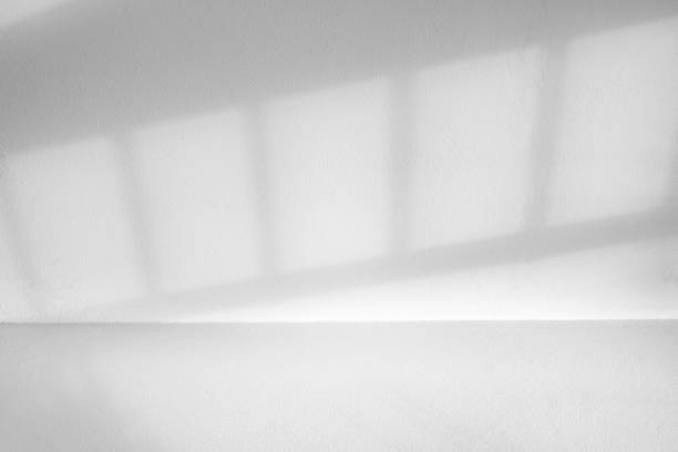 istock Wall interior background, studio and backdrops show products.with shadow from window color white . background for text insertion and presentation product 2154081378