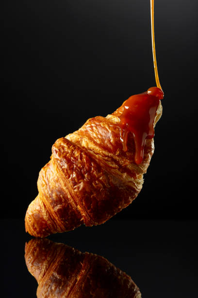 istock Fresh baked croissant with caramel sauce. 2154083018