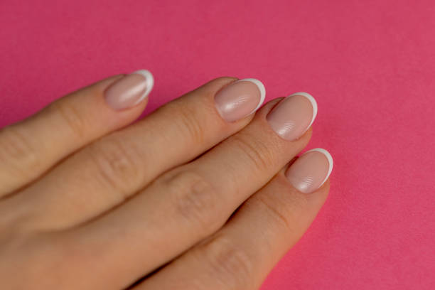 istock beautiful nails on a girl's hand 2154083024