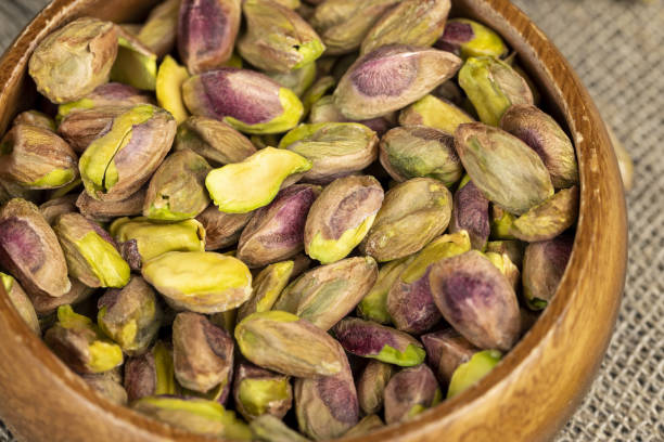 istock delicious salted green pistachios without shells 2154083136