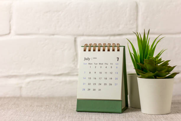 istock Desk calendar for July 2024 on the desktop. 2154083373
