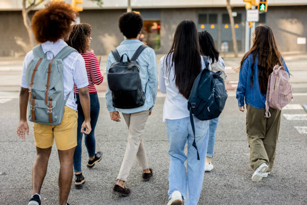 istock College Students Walking and Chatting on Campus Walkway 2154084149