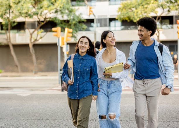 istock College Friends Walking and Laughing Together 2154084182