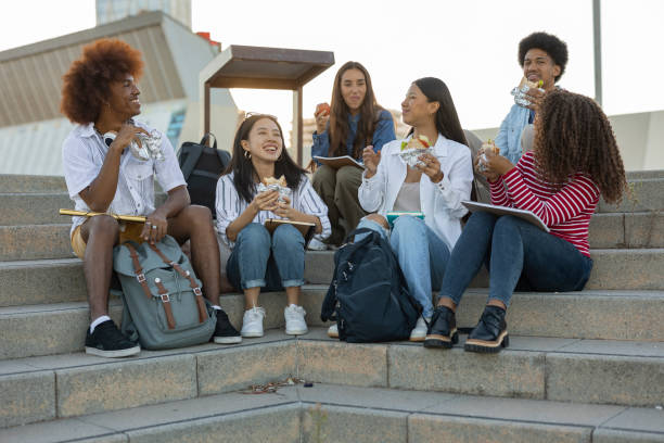 istock College Students Walking and Chatting on Campus Walkway 2154084195