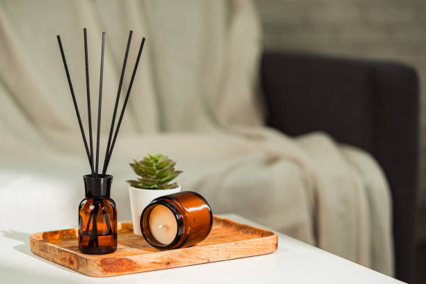 istock Aromatic reed freshener and candle on table in room 2154084980